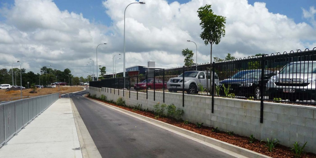 Bremer Carpark Loop Top Aluminium fence bolted to retaining wall