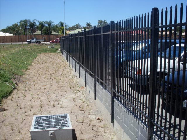 Steel Security Bolted to Retainer Wall Crimped Spear Top