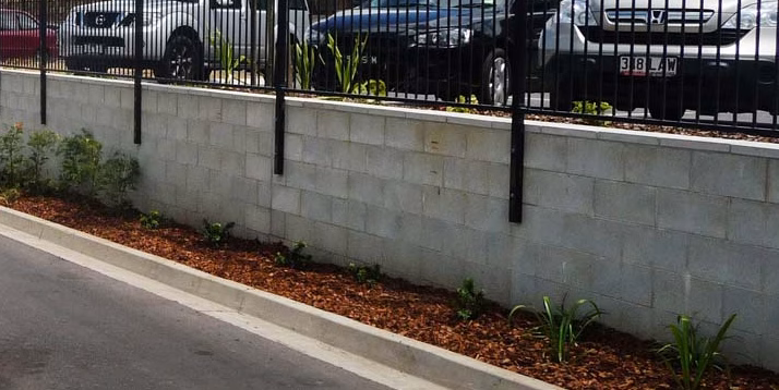 Bremer Carpark Loop Top Aluminium fence bolted to retaining wall